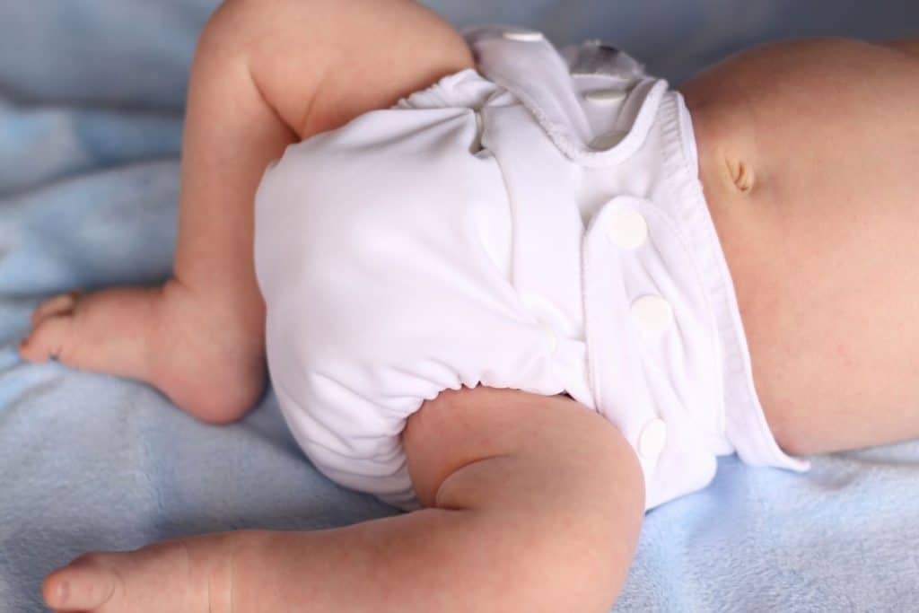 A baby wearing a cloth diaper